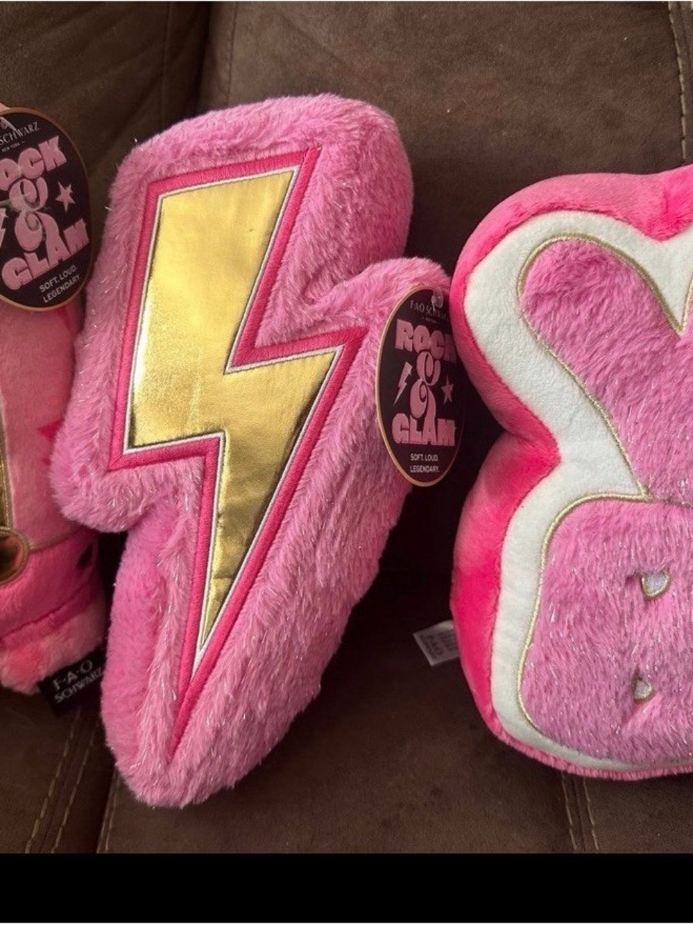 FAO Schwarz Pink Plush Lightning Bolt Pillow with Gold Center